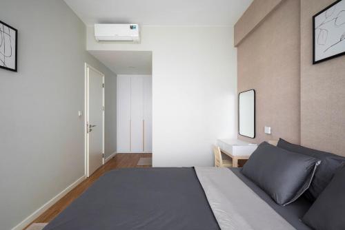Postel nebo postele na pokoji v ubytování Masteri Residence Heera Stay Apartment