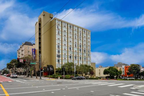 a large building on the corner of a city street at Comfort Inn By the Bay in San Francisco