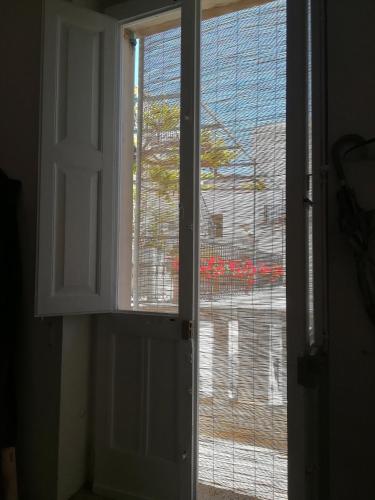 an open window with a view of a building at Vista Castello - Otranto in Otranto