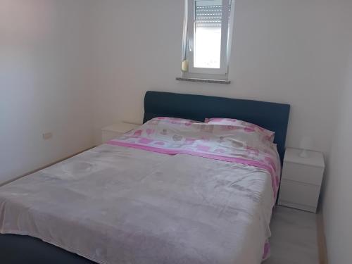 Posteľ alebo postele v izbe v ubytovaní Apartman Dezire