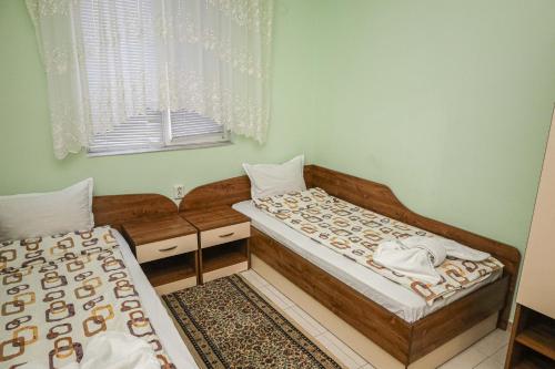 Кровать или кровати в номере Edi Hotel