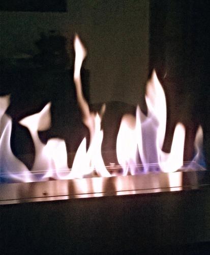 a close up of a lit up object with flames at Casa Flôr - Beira rio Centro de Lumiar in Lumiar