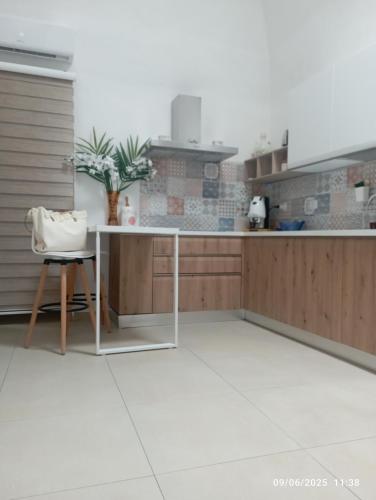 a kitchen with a table and a chair at ALMAREDo in Bisceglie