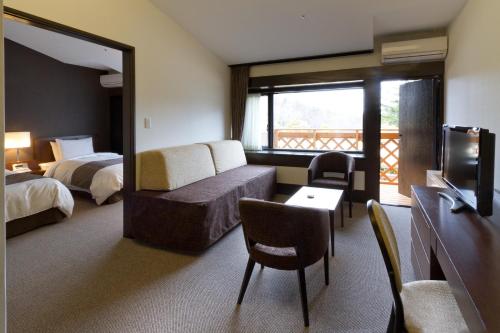 Postel nebo postele na pokoji v ubytování Yatsugatake Kogen Lodge