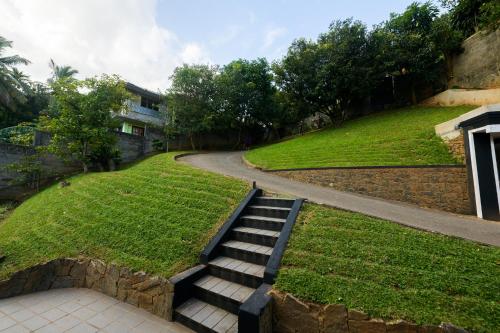 a set of stairs leading up to a road at Eden Kandy in Kandy