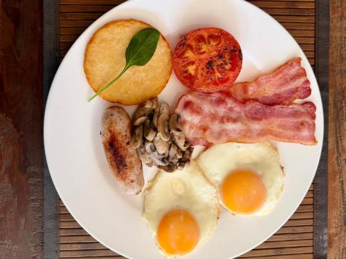 a plate of breakfast food with eggs and nuts at NO4 Lilliput - Sandton Executive Guest House - OPENING SPECIAL in Sandton