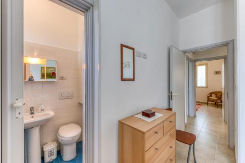 a small bathroom with a sink and a toilet at Villa Terra Rossa in Torre San Giovanni Ugento