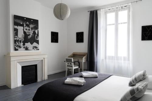 Postel nebo postele na pokoji v ubytování Carcassonne Bastide Appartements