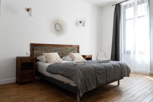 Postel nebo postele na pokoji v ubytování Carcassonne Bastide Appartements