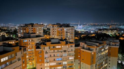a view of a city at night with buildings at Kомната под ключ - Bedroom - Cameră la cheie in Chişinău