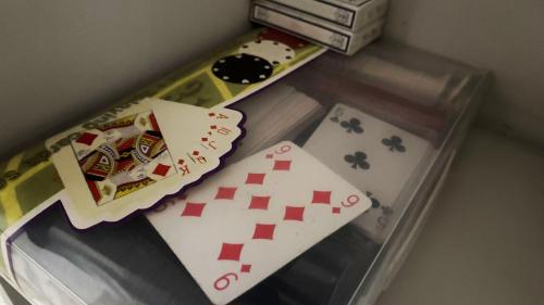 a plastic container with playing cards and poker chips at The Local Pin House - Ευρύχωρη μονοκατοικία, Λαμία in Lamía