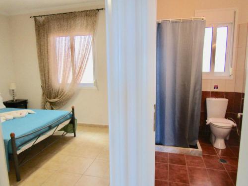A bathroom at Barbati Beach Apartments