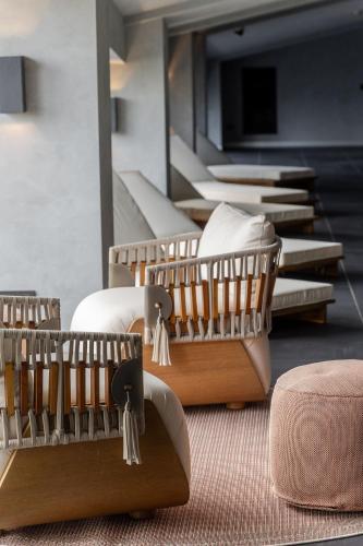 a group of chairs with tassels on them in a room at Pullman Riga Old Town in Rīga