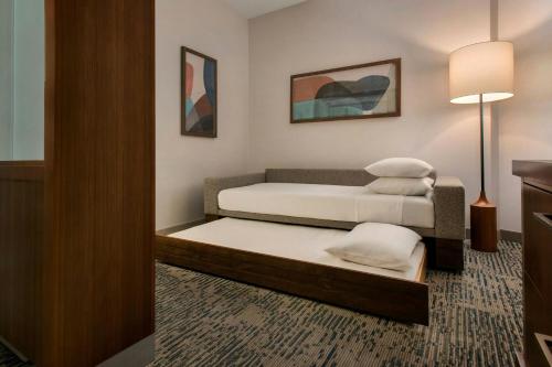 a room with two beds and a lamp at SpringHill Suites by Marriott Mount Laurel in Mount Laurel
