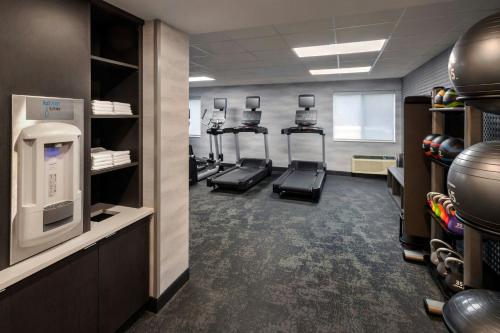 a gym with several treadmills and machines in it at Fairfield Inn by Marriott Amesbury in Amesbury