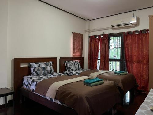 Postel nebo postele na pokoji v ubytování Poolvilla Armthong Home