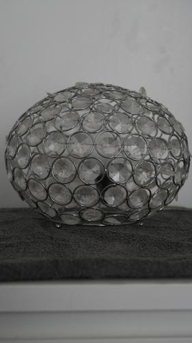 a metal bowl sitting on top of a table at Lux Apartment in Gatwick in Crawley