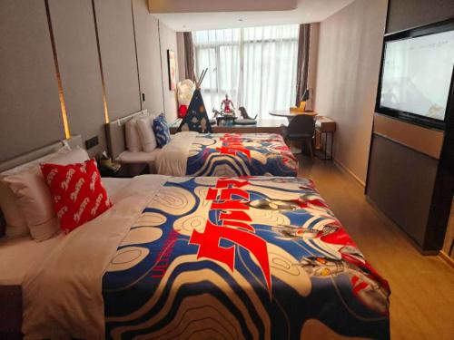 a hotel room with two beds and a flat screen tv at Atour Hotel Jiading Jiangqiao Jiayi Road Subway Station in Fengbang
