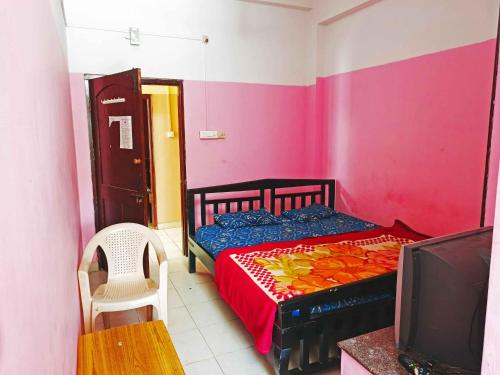 Postel nebo postele na pokoji v ubytování Shree Renuka Residency