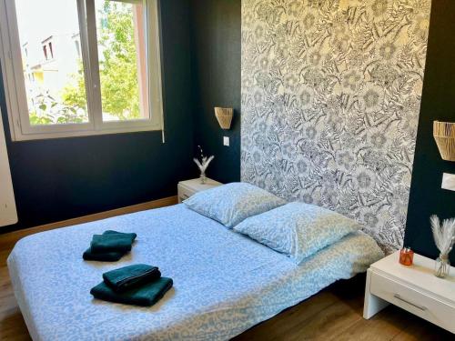 Posteľ alebo postele v izbe v ubytovaní En sol'eau -Appartement à 50 m de la plage