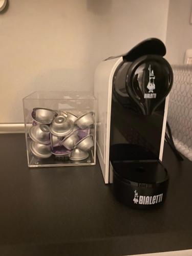 a box of silver bells sitting next to a coffee maker at B&Bi13 in Magenta