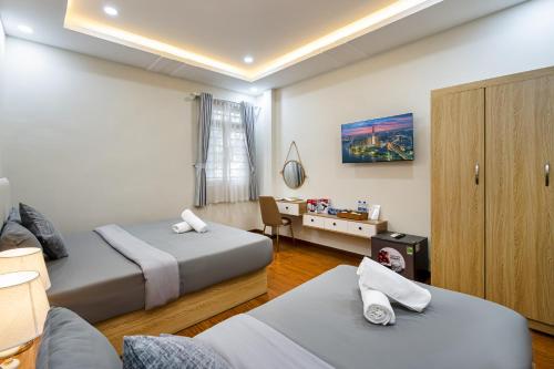Postel nebo postele na pokoji v ubytování Annie House