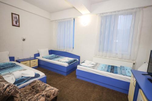 Кровать или кровати в номере Edi Hotel