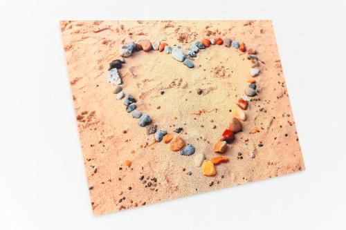a heart made out of pebbles at Ferienwohnungen Haus Boje in Neuharlingersiel