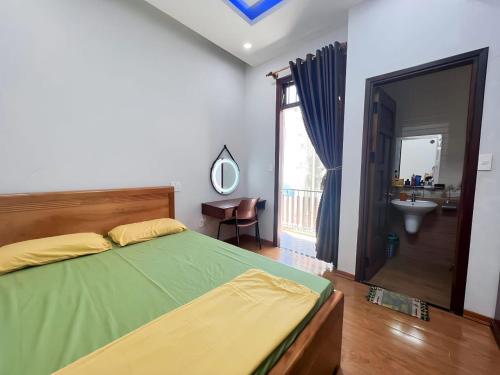 Postel nebo postele na pokoji v ubytování GGO homestay