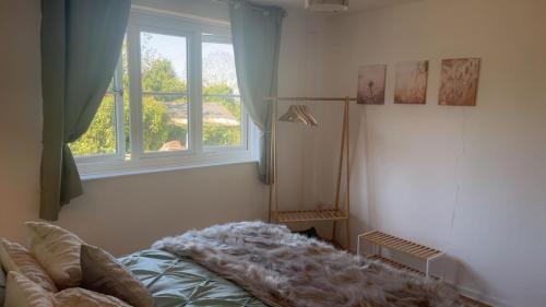 a bedroom with a bed and a window at Mountain View, Brecon Beacons in Trefeinon Station