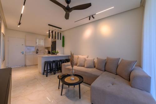 a living room with a couch and a table at Royal Suite Caesarea in Caesarea