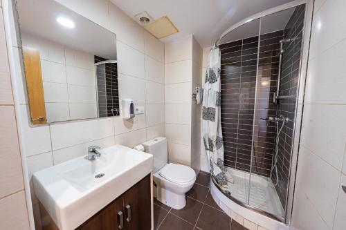 a bathroom with a sink and a toilet and a shower at Park Suites Family Rentalmar in Salou