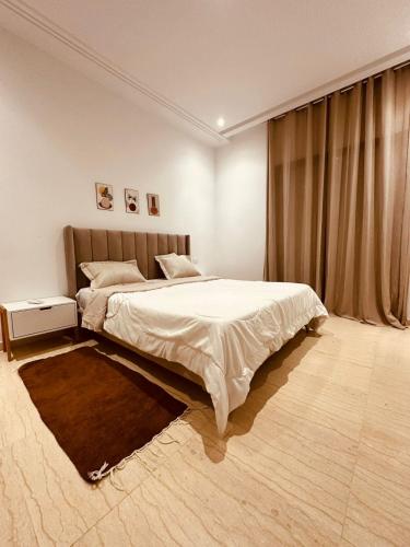 a bedroom with a large bed and a window at luxueux S2 a Jardin de Carthage in Sidi Daoud