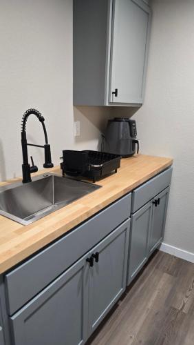 a kitchen with a sink and a counter top at Alanas house in Denver