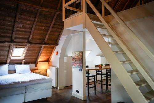 Letto o letti in una camera di Boutique Hotel-Restaurant "De Zwarte Boer"