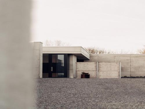 a building with a glass door in front of it at Cozy Villa in Dalhem Ardennes with Private Garden in Dalhem