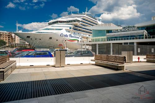 a cruise ship is docked in a harbor at Garden Paradise - Free Parking - Terminal 4min in Savona