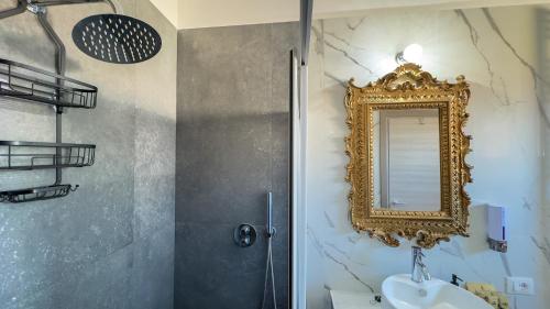 a bathroom with a sink and a mirror on the wall at B&B Antenna 2 by Ca-Sa Check in Chioggia