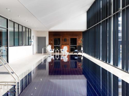 an office building with a view of the lobby at Ibis Styles Hobart in Hobart