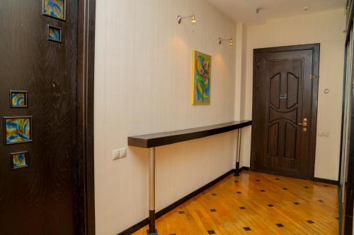 a room with a hallway with a door and a counter at Sunday Hotel & Apartments in Baku