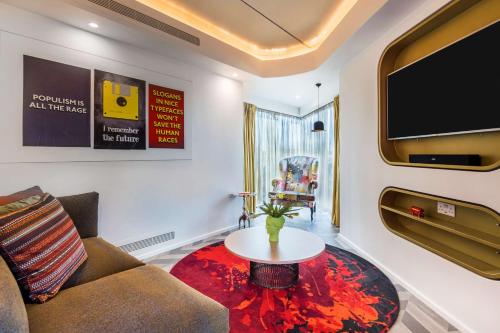 a living room with a couch and a table at nhow London in London