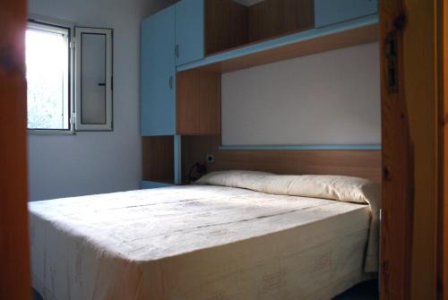 En eller flere senger på et rom på Villaggio Mascia