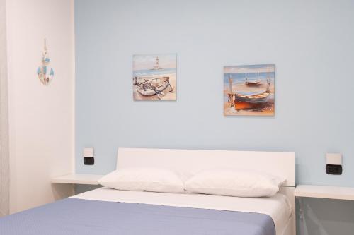 Ένα ή περισσότερα κρεβάτια σε δωμάτιο στο B&B L'Oblo'