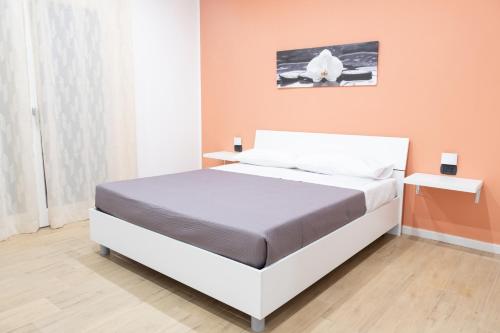 Ένα ή περισσότερα κρεβάτια σε δωμάτιο στο B&B L'Oblo'