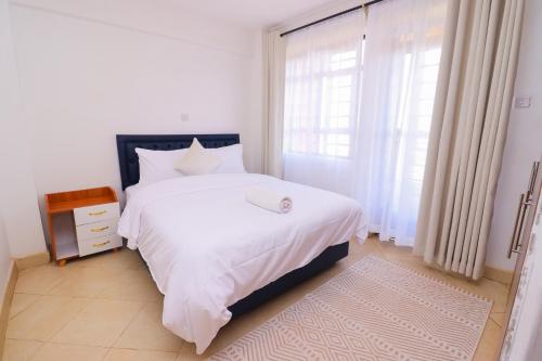 Giường trong phòng chung tại Pamstays