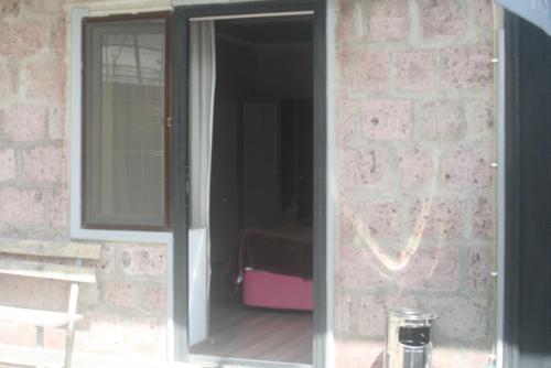 a sliding glass door of a room with a bedroom at Hotel Rabati in Akhaltsikhe