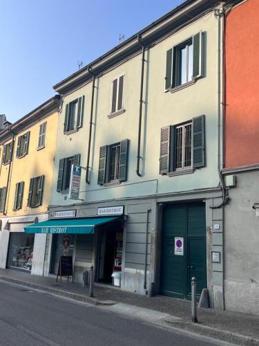 a building on the side of a street at Como Charm Living Apartment Duomo in Como