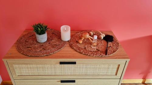 a table with two plates of food on it at La Vallée Secrète - Love Hôtel 