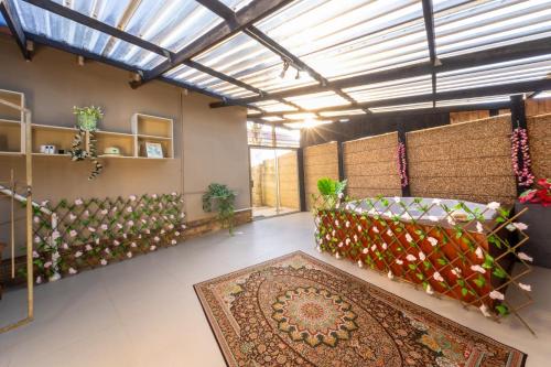 a large room with a large rug on the floor at Pelican Palms Aston Jeffreys Bay in Jeffreys Bay