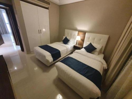 Кровать или кровати в номере Belvilla Luxury Downtown Adliya Formerly Jewel Hotel